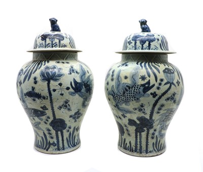 Lot 135 - A pair of Chinese blue and white vases and covers