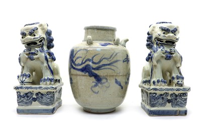 Lot 140 - A pair of Chinese blue and white Buddhist lions