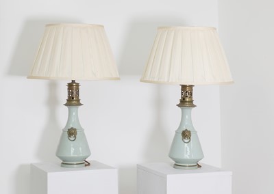 Lot 41 - A pair of Napoleon III celadon-glazed pottery table lamps