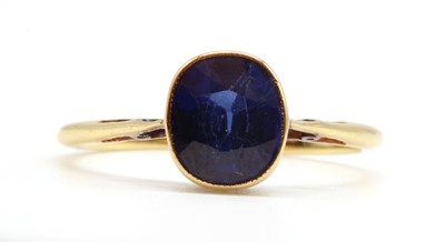 Lot 198 - A gold single stone synthetic sapphire ring