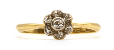 Lot 76 - A gold diamond daisy cluster ring