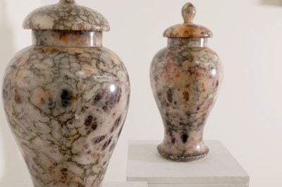 Lot 143 - A pair of rouge alabaster vases and covers