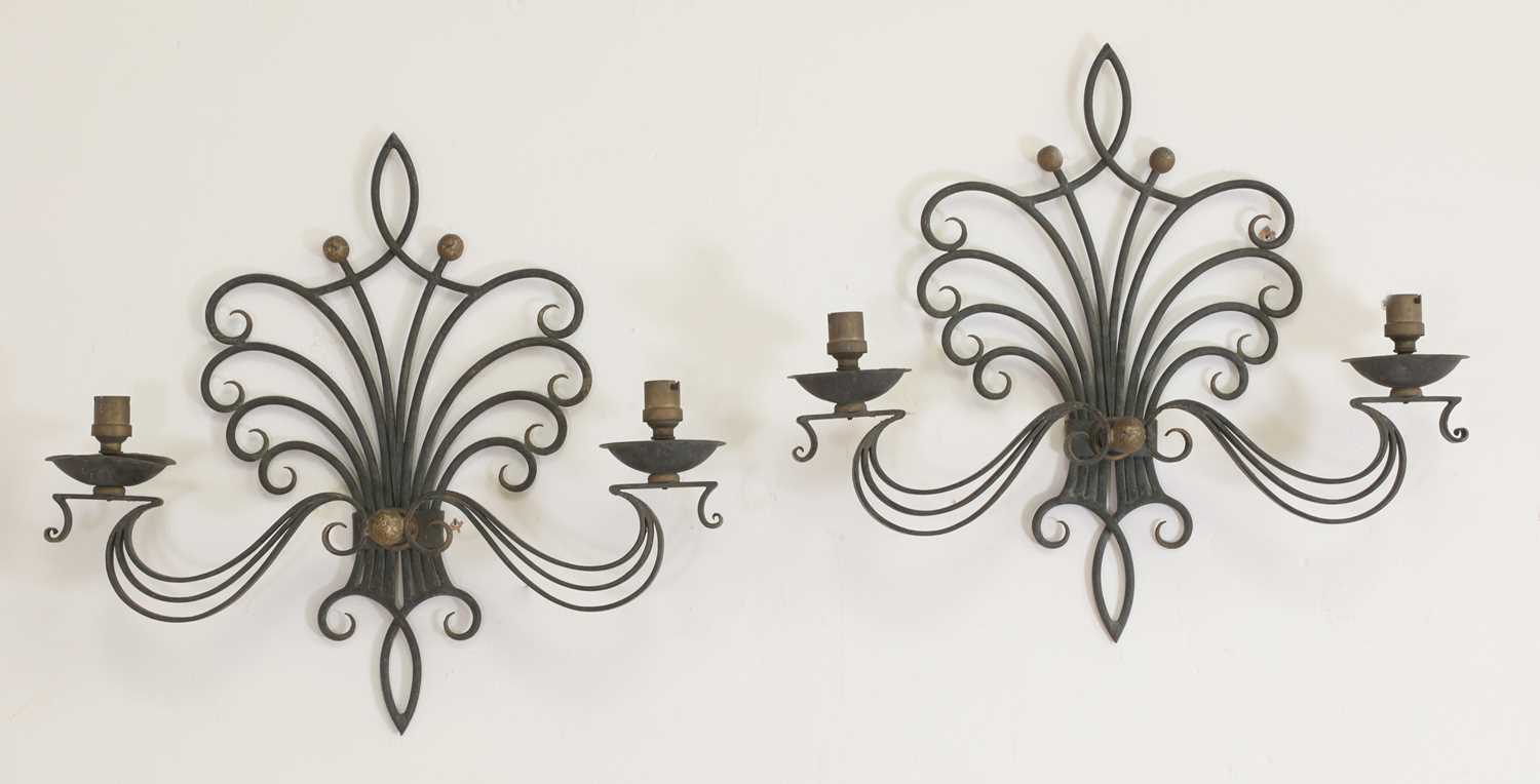 Lot 150 - A pair of painted wrought iron twin-branch wall sconces