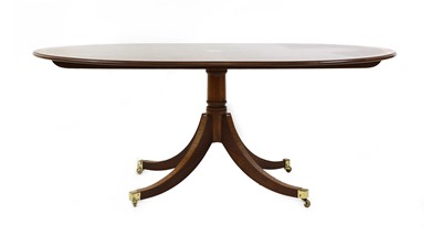 Lot 354 - A Regency style mahogany and satinwood crossbanded dining table