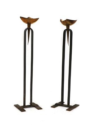 Lot 472 - A pair of modernist copper and iron floor standing torcheres