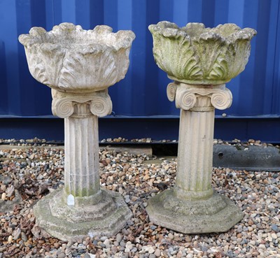 Lot 487 - A pair of reconstituted stone garden jardinieres on stands