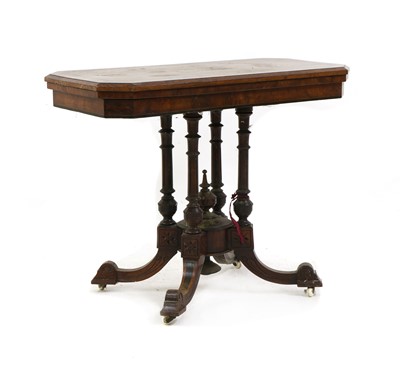 Lot 425 - A Victorian figured walnut card table