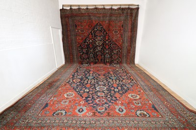 Lot 566 - A large Persian wool carpet