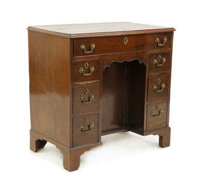 Lot 408 - A George III style mahogany kneehole desk