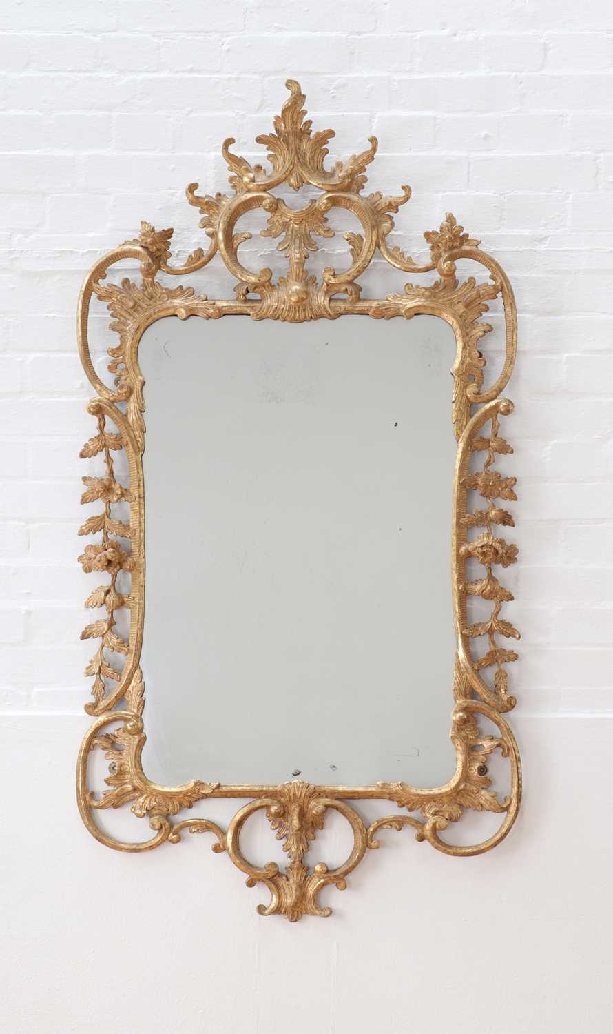 Lot A George III giltwood wall mirror