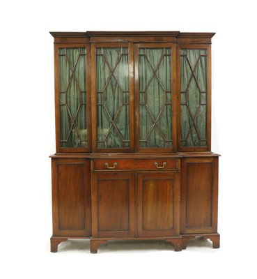 Lot 483 - A George III style mahogany breakfront bookcase