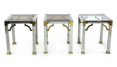 Lot 412 - A set of three brass and chrome lamp tables
