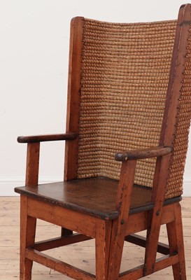 Lot 562 - An oak and pine armchair
