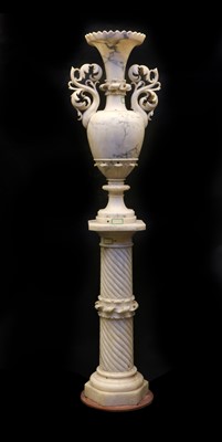 Lot 519A - A large alabaster vase on a pedestal stand