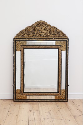 Lot 164 - An ebonised walnut and brass wall mirror