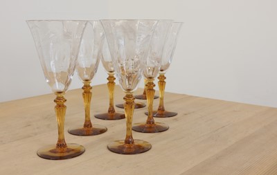 Lot 83 - A set of eight clear and amber glass goblets