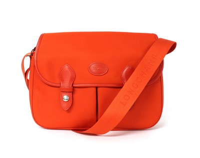 Lot 377 - A Longchamp orange messenger bag