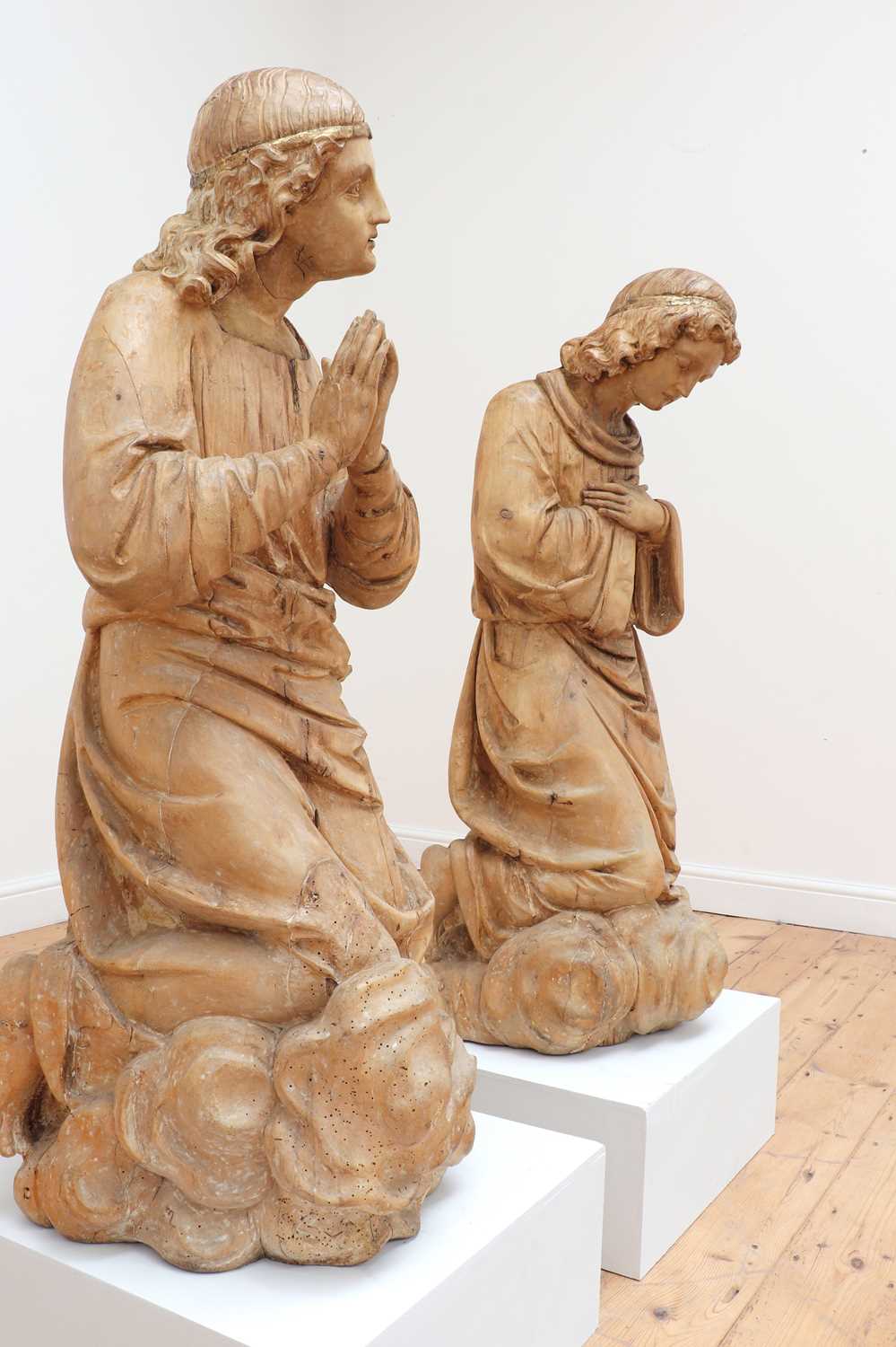 Lot 142 - A pair of monumental carved limewood figures