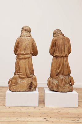 Lot 142 - A pair of monumental carved limewood figures