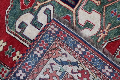 Lot 324 - A hand knotted Kazak wool rug