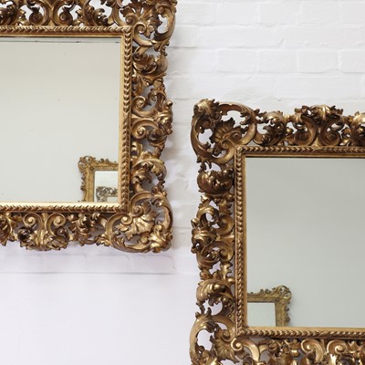 Lot 111 - A pair of Florentine carved giltwood mirrors