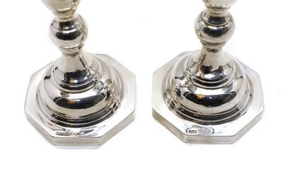 Lot 11 - A pair of silver candlesticks