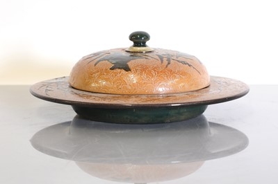 Lot 8 - A Doulton Lambeth stoneware butter dish and cover
