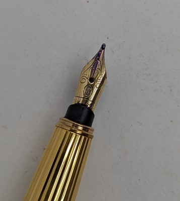 Lot 20 - A Cartier 'Pasha de Cartier' gold plated fountain pen
