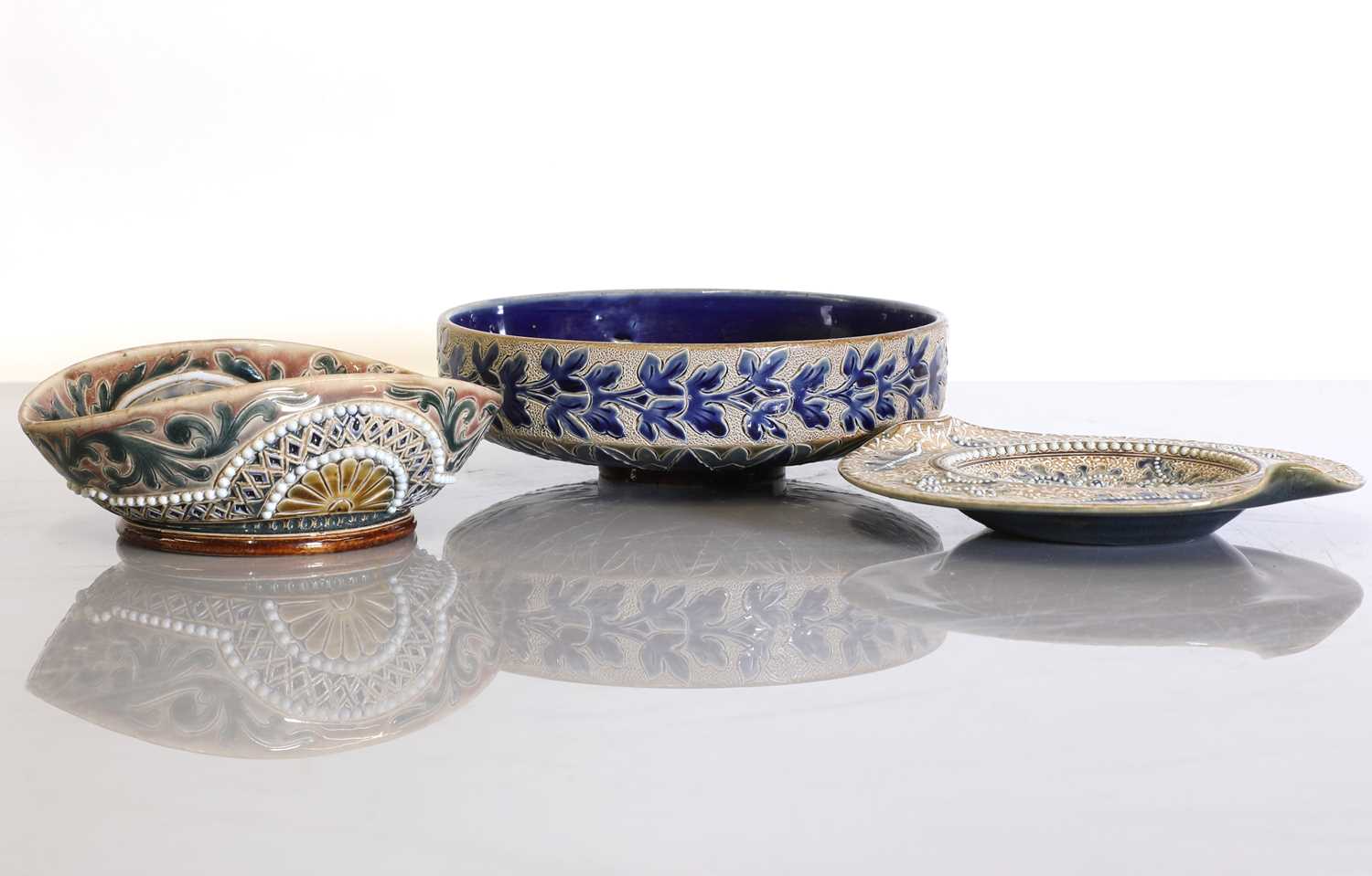 Lot 13 - Three Doulton Lambeth stoneware dishes