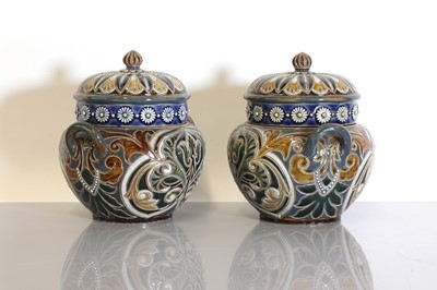 Lot 20 - A pair of Doulton Lambeth tobacco jars, lids and covers