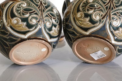 Lot 20 - A pair of Doulton Lambeth tobacco jars, lids and covers