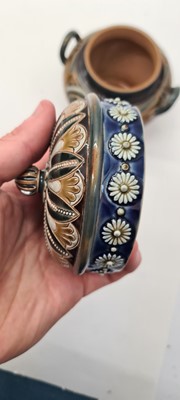 Lot 20 - A pair of Doulton Lambeth tobacco jars, lids and covers