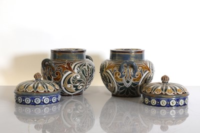 Lot 20 - A pair of Doulton Lambeth tobacco jars, lids and covers
