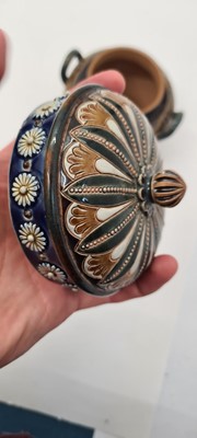 Lot 20 - A pair of Doulton Lambeth tobacco jars, lids and covers