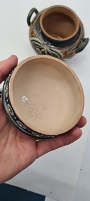 Lot 20 - A pair of Doulton Lambeth tobacco jars, lids and covers