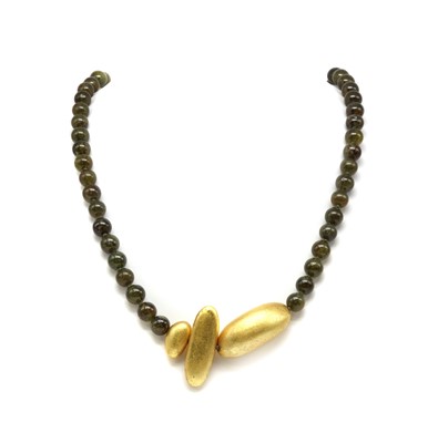 Lot 163 - A green grossular garnet bead necklace