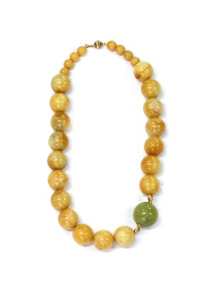 Lot 147 - A serpentine and jade bead necklace