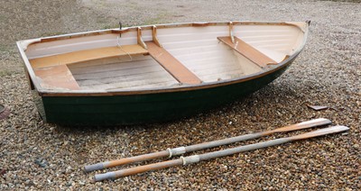 Lot 496 - A fibreglass rowing boat