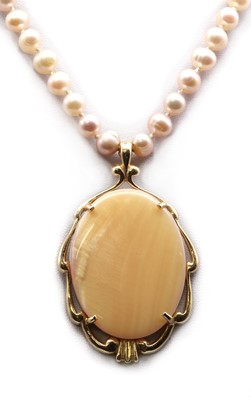 Lot 251 - A gold painted mother-of-pearl pendant