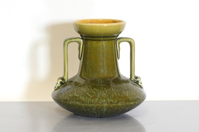 Lot 184 - A Linthorpe Pottery twin-handled vase