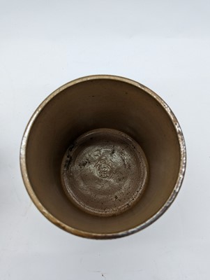 Lot 41 - A Doulton Lambeth stoneware tobacco jar and two pots