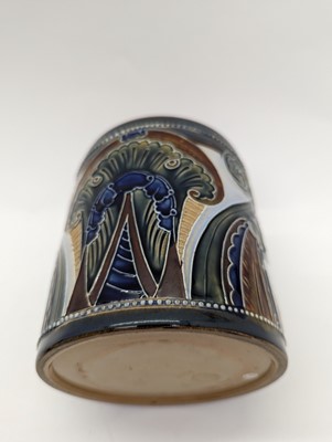 Lot 41 - A Doulton Lambeth stoneware tobacco jar and two pots