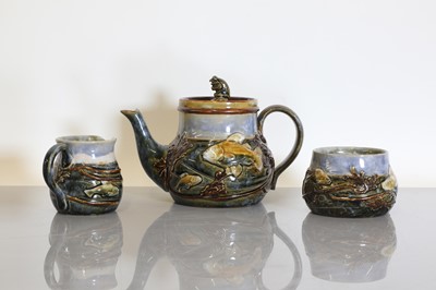 Lot 1 - A Royal Doulton stoneware three-piece tea set