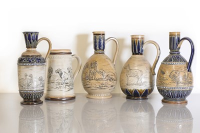 Lot 33 - A collection of five Doulton Lambeth stoneware ewers