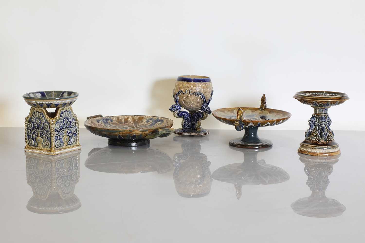 Lot 92 - A collection of Doulton Lambeth stoneware tazzas, stands and a match holder
