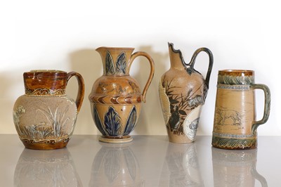 Lot 34 - Four Doulton Lambeth stoneware jugs and ewers