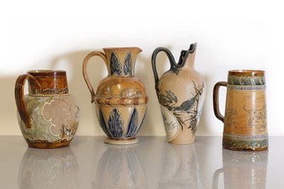 Lot 34 - Four Doulton Lambeth stoneware jugs and ewers