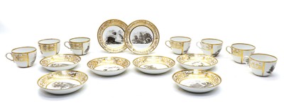 Lot 66 - A monochrome and gilt set of cups and saucers