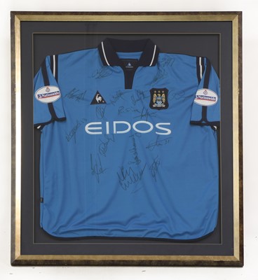 Lot 215 - A framed Manchester City Football Shirt