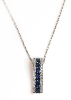 Lot 197 - A white gold sapphire and diamond arched bar pendant